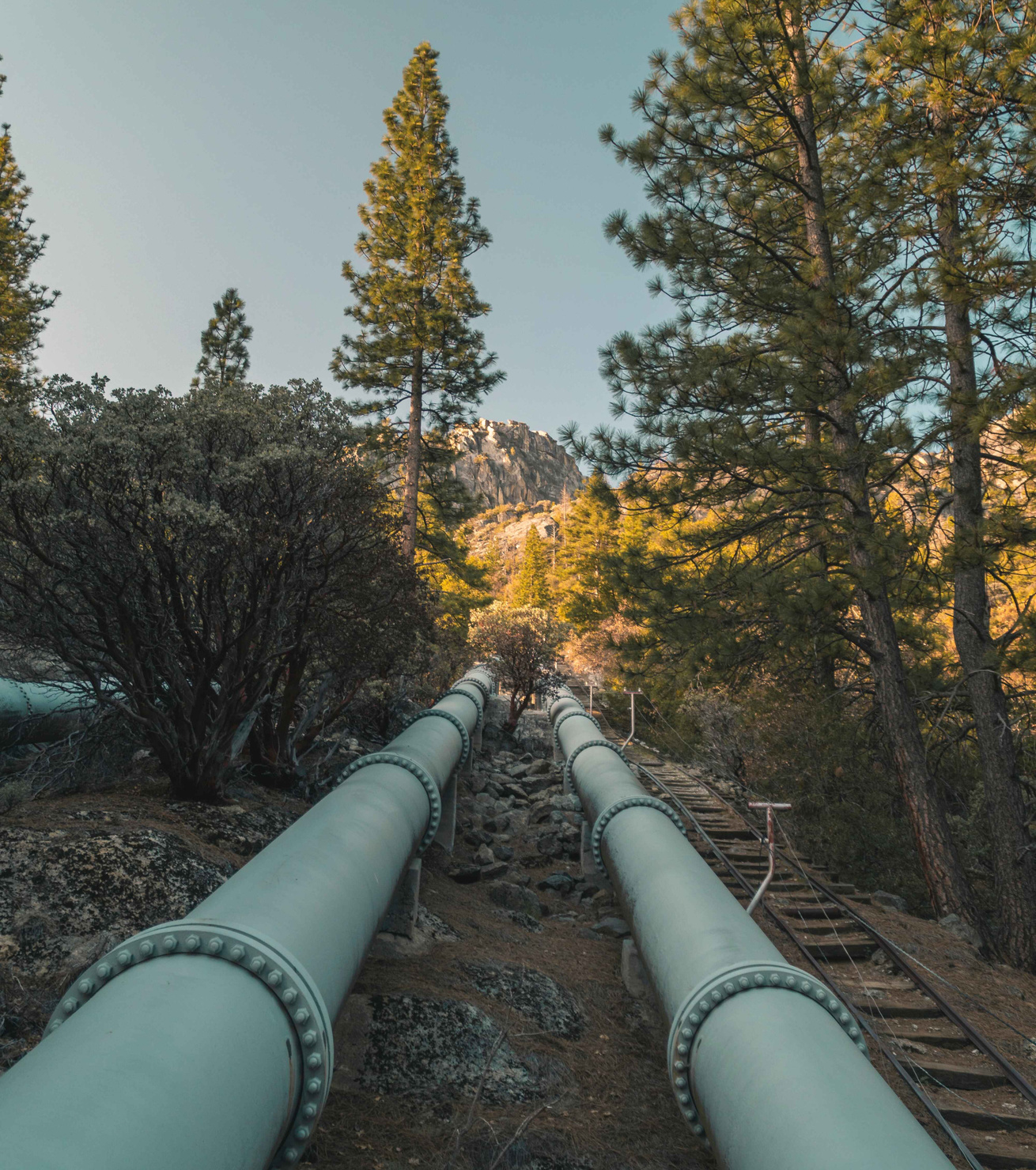 Big Creek Water Station Water pipeline entering mountains from pump station, Big Creek, CA
